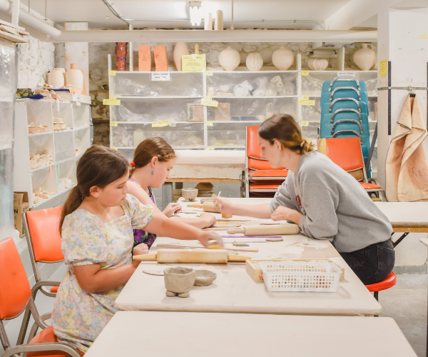 Pottery students working in the studio.